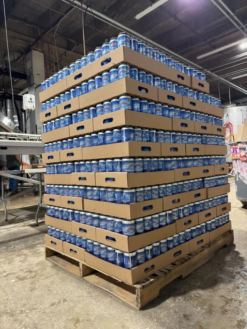 A shrink-wrapped pallet of Himalayan cases in a warehouse